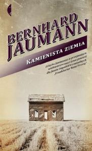 Kamienista ziemia. Autor: Bernhard Joumman. Dobreksiazki.pl Okładka książki Kamienista ziemia